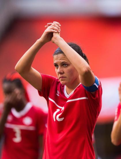 VANCOUVER, BC - JUNE 27: Christine Sinclair #12 of Canada salutes the crowd after losing to England 2-1 in the FIFA Women&#39;s World Cup Canada 2015 Quarter Final match between the England and Canada June, 27, 2015 at BC Place Stadium in Vancouver, British Columbia, Canada.  (Photo by Rich Lam/Getty Images)