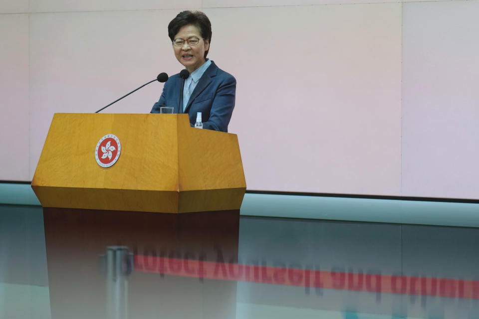 Hong Kong Chief Executive Carrie Lam listens to questions during a press conference in Hong Kong, Tuesday, May 25, 2021. Lam on Tuesday defended Hong Kong as an attractive place for businesses, after a recent survey found many foreigners were considering leaving the longtime Asian business hub. (AP Photo/Vincent Yu)