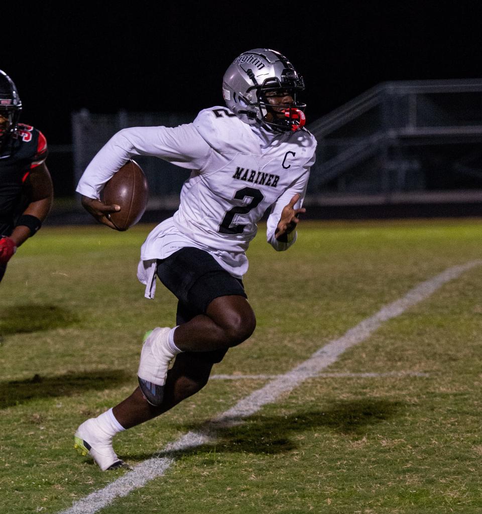Mariner's Justin Lewis runs the ball during Friday's game at South Fort Myers
