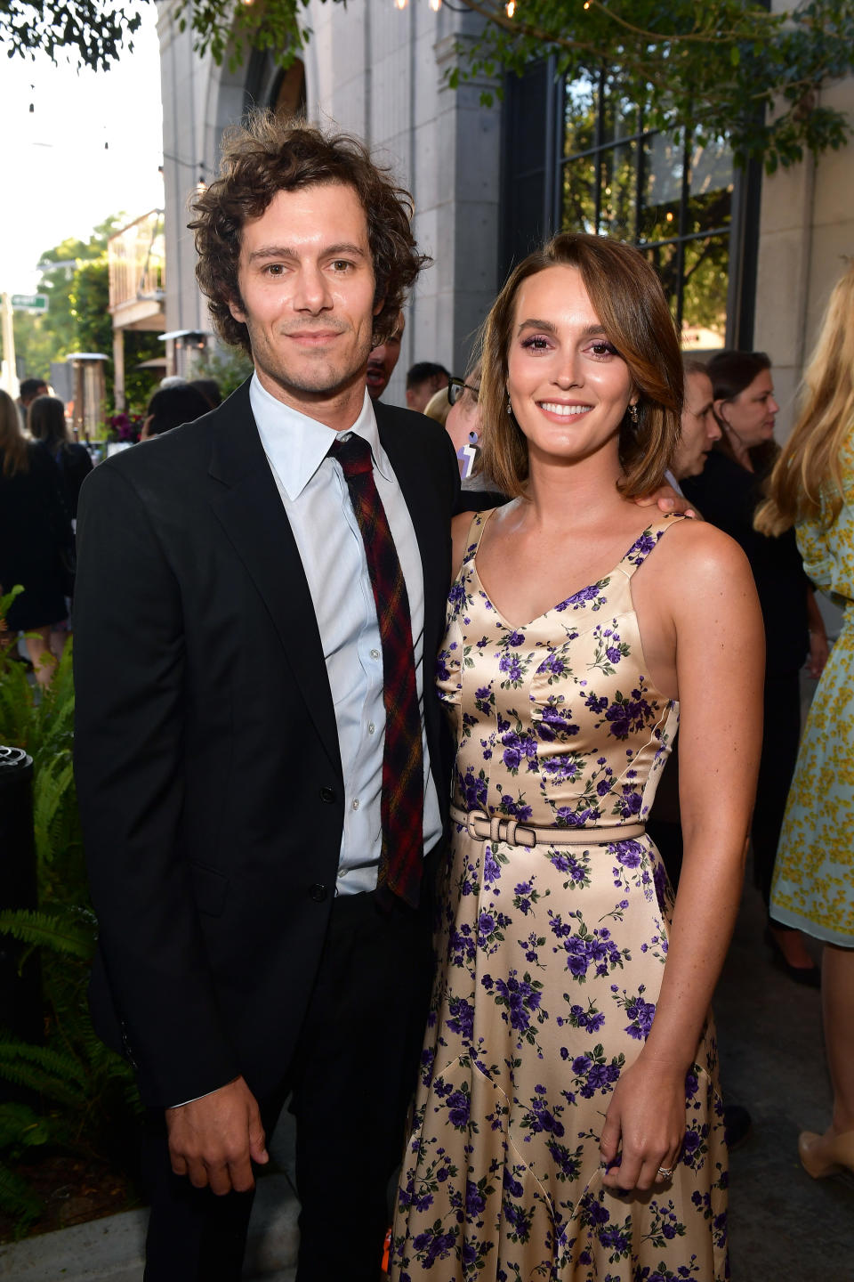 the couple smiling at an event