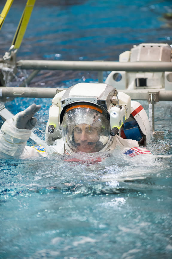 NASA astronaut Chris Cassidy, Expedition 35/36 flight engineer, attired in a training version of his Extravehicular Mobility Unit (EMU) spacesuit, is submerged in the waters of the Neutral Buoyancy Laboratory (NBL) near NASA's Johnson Space Cen