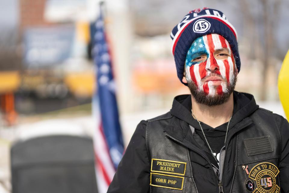 “Corn Pop”, a Trump supporter from Maine, poses for a photo while he waits outside in the cold for former president Donald J. Trump to speak at a campaign rally at SNHU Arena in Manchester, NH, on Saturday, January 20, 2024.