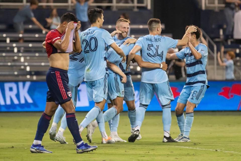 Sporting Kansas City forward Khiry Shelton (No. 11) is surrounded by teammates after scoring the go-ahead goal in extra time during a U.S. Open Cup Round of 32 match against FC Dallas on Tuesday at Children’s Mercy Park in Kansas City, Kan.