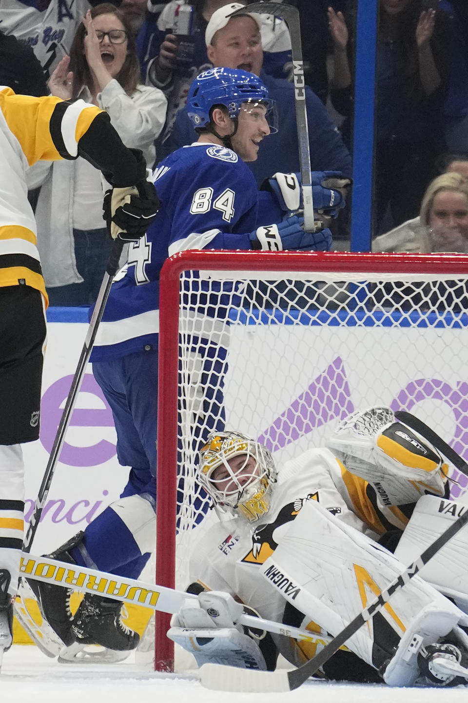 Tampa Bay Lightning left wing Tanner Jeannot (84) celebrates after scoring past Pittsburgh Penguins goaltender Tristan Jarry (35) during the first period of an NHL hockey game Thursday, Nov. 30, 2023, in Tampa, Fla. (AP Photo/Chris O'Meara)
