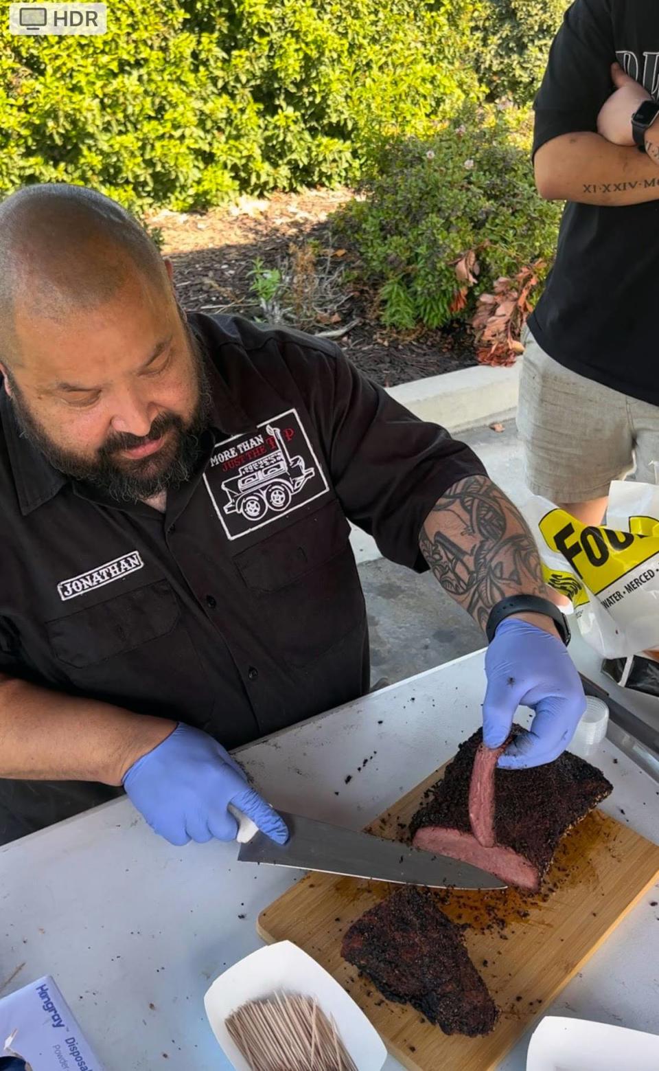 Jonathan Carbajal carves his tri-tip at the Meat Market Mania III competition in Clovis on Saturday, May 21. “When I sliced it, we had customers saying, ‘You know what you’re doing.’” His tri-tip placed first in the competition.