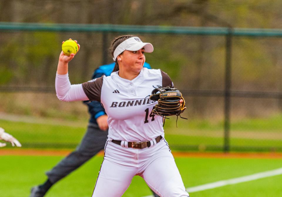 Former Milford softball player Emily Piergustavo readies a throw to first base last season at St. Bonaventure last season. She'll begin her coaching career as an assistant at Tufts.