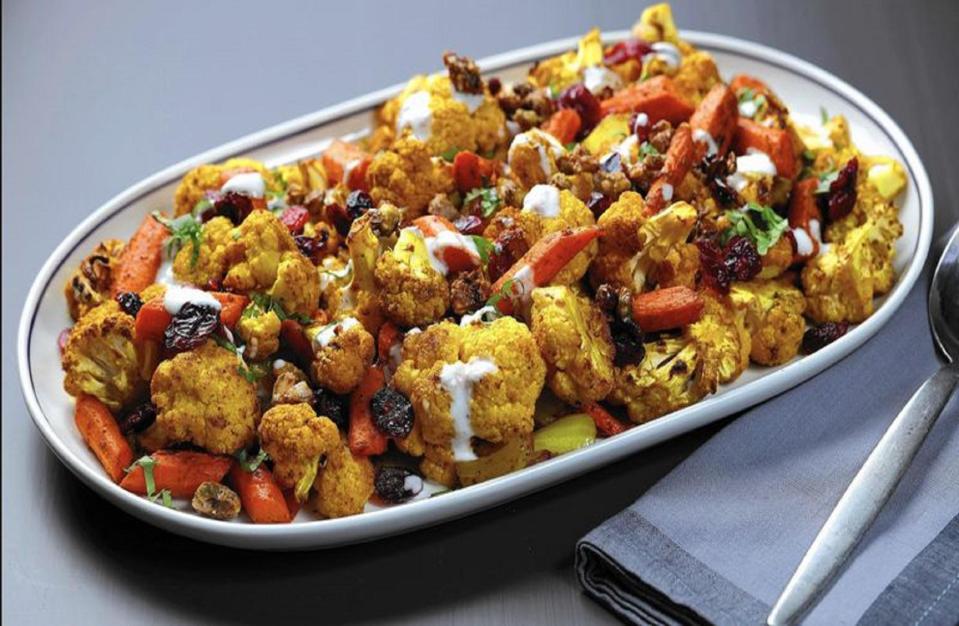 <p>This grilled cauliflower recipe can be paired as a side dish with your favorite <a href="https://www.thedailymeal.com/cook/grilled-chicken-not-boring?referrer=yahoo&category=beauty_food&include_utm=1&utm_medium=referral&utm_source=yahoo&utm_campaign=feed" rel="nofollow noopener" target="_blank" data-ylk="slk:grilled chicken;elm:context_link;itc:0;sec:content-canvas" class="link ">grilled chicken</a>, but you can also eat this savory dish on its own. Add wood chips to your charcoal grill to achieve a super smoky flavor.</p> <p><a href="https://www.thedailymeal.com/recipes/cauliflower-carrot-grill-roasted?referrer=yahoo&category=beauty_food&include_utm=1&utm_medium=referral&utm_source=yahoo&utm_campaign=feed" rel="nofollow noopener" target="_blank" data-ylk="slk:For the Wood-smoked Cauliflower and Carrots With Pistachio Crunch recipe, click here.;elm:context_link;itc:0;sec:content-canvas" class="link ">For the Wood-smoked Cauliflower and Carrots With Pistachio Crunch recipe, click here.</a></p>