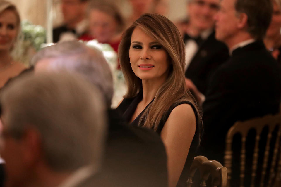 WASHINGTON, DC - FEBRUARY 26: AFP OUT U.S. first lady Melania Trump listens to a toast by her husband President Donald Trump while hosting the annual Governors' Dinner in the East Room of the White House February 26, 2017 in Washington, DC. Part of the National Governors Association�s annual meeting in the nation's capital, the black tie dinner and ball is the first formal event the Trumps will host at the White House since moving in last month. (Photo by Chip Somodevilla/Pool) *** Please Use Credit from Credit Field ***