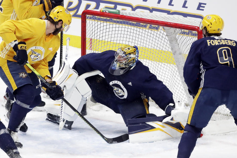 Nashville Predators goaltender Pekka Rinne, of Finland, of Finland, blocks a shot during NHL hockey training camp Tuesday, July 14, 2020, in Nashville, Tenn. (AP Photo/Mark Humphrey)