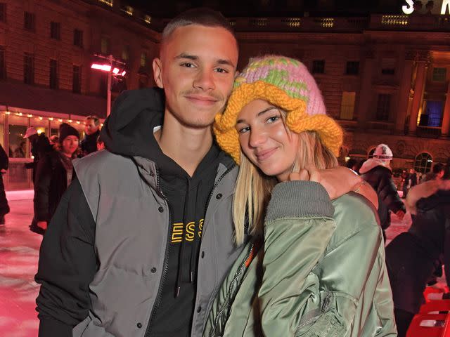 <p>David M. Benett/Dave Benett/Getty</p> Romeo Beckham and Mia Regan at the opening party of Skate at Somerset House in November 2021 in London, England.