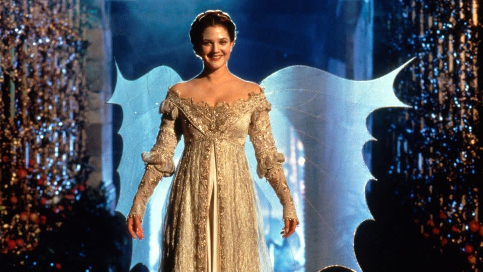 The dress worn here by Drew Barrymore in "Ever After: A Cinderella Story" was among many other costumes up for auction. - Alamy Stock Photo