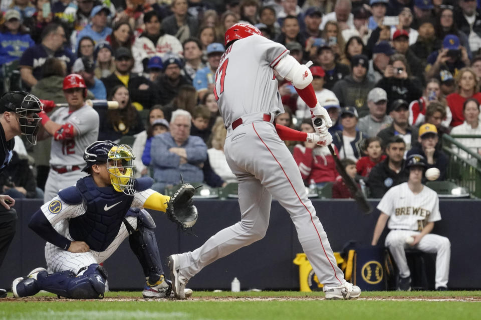 Los Angeles Angels' Shohei Ohtani hits a solo home run during the third inning of a baseball game against the Milwaukee Brewers, Sunday, April 30, 2023, in Milwaukee. (AP Photo/Aaron Gash)