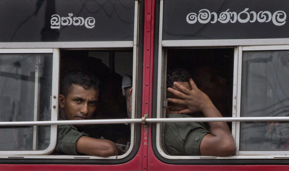 FILE - In this April 29, 2019, file photo, soldiers return to their base following an operation searching for explosives and suspects tied to a local group of Islamic State militants in Kalmunai, Sri Lanka. Worries about Islamic extremism will be paramount for many Sri Lankan voters while others hope to block former leaders accused of human rights violations from returning to power in Saturday’s presidential election, the country’s first national polls since last Easter’s deadly suicide attacks. Simply put, fear is driving the election in Sri Lanka, a South Asian island nation of 22 million people off India’s southern tip. (AP Photo/Gemunu Amarasinghe, File)