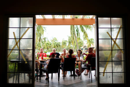 Tourists from England and Scotland have drinks in a hotel a day after the passage of Hurricane Irma in Varadero, Cuba, September 10, 2017. REUTERS/Alexandre Meneghini