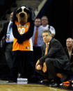 CHARLOTTE, NC - MARCH 18: Head coach Bruce Pearl of the Tennessee Volunteers kneels down on the sideline before the Volunteers were defeated 75-45 by the Michigan Wolverines during the second round of the 2011 NCAA men's basketball tournament at Time Warner Cable Arena on March 18, 2011 in Charlotte, North Carolina. (Photo by Kevin C. Cox/Getty Images)