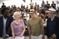 Jean-Christophe Folly, from left, Vicki Berlin, Woody Harrelson, and Henrik Dorsin pose for photographers at the photo call for the film 'Triangle of Sadness' at the 75th international film festival, Cannes, southern France, Sunday, May 22, 2022. (AP Photo/Daniel Cole)
