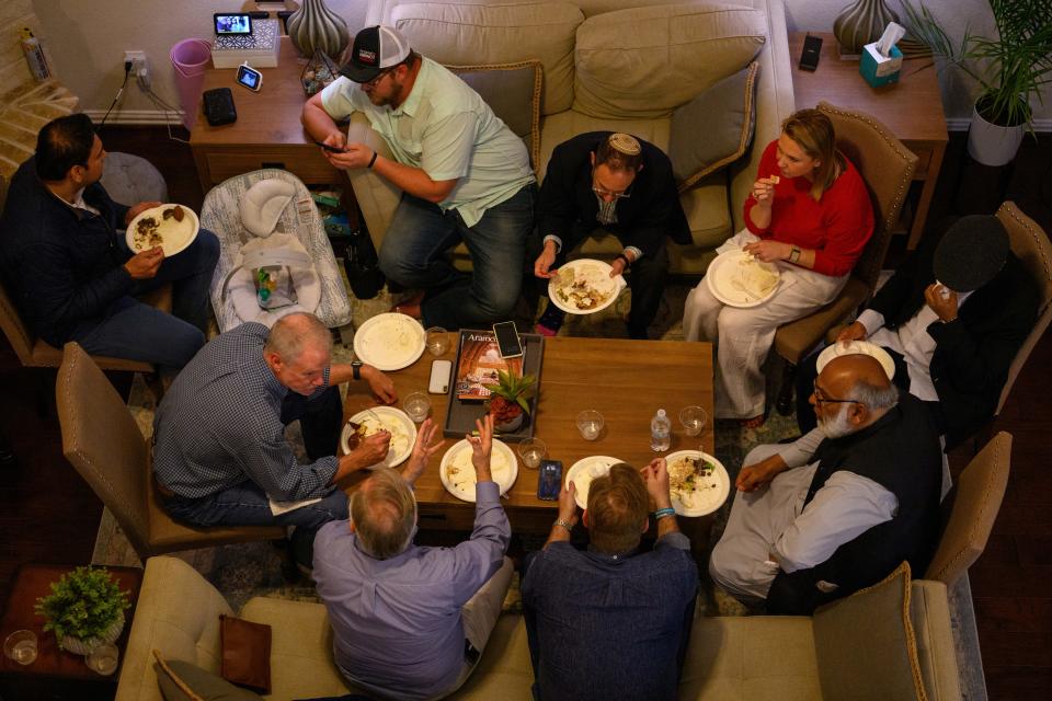 As the Israel-Hamas conflict nears the six-month mark, friends of different faiths gather for iftar at the home of Shariq Ghani in Richmond, Texas, on Tuesday.