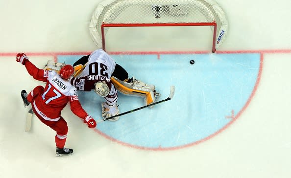 Denmark's forward Nicklas Jensen scores the game-winning penalty shot past Latvia's goalie Elvis Merzlikins during the group A preliminary round game Denmark vs Latvia at the 2016 IIHF Ice Hockey World Championship in Moscow on May 13, 2016. / AFP / YURI KADOBNOV (Photo credit should read YURI KADOBNOV/AFP/Getty Images)
