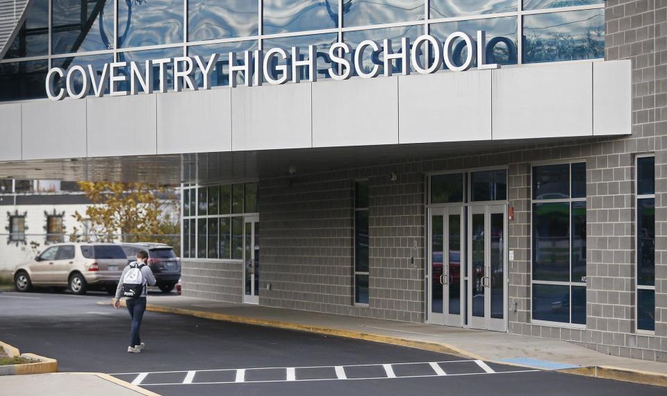 A student walks into Coventry High School in November.