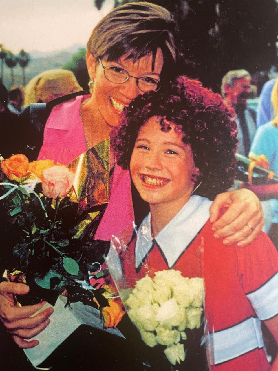 Carrie St. Louis with her mother, Robin St. Louis, after appearing in a youth On Stage Theater Company production of "Annie" at the McCallum Theatre.