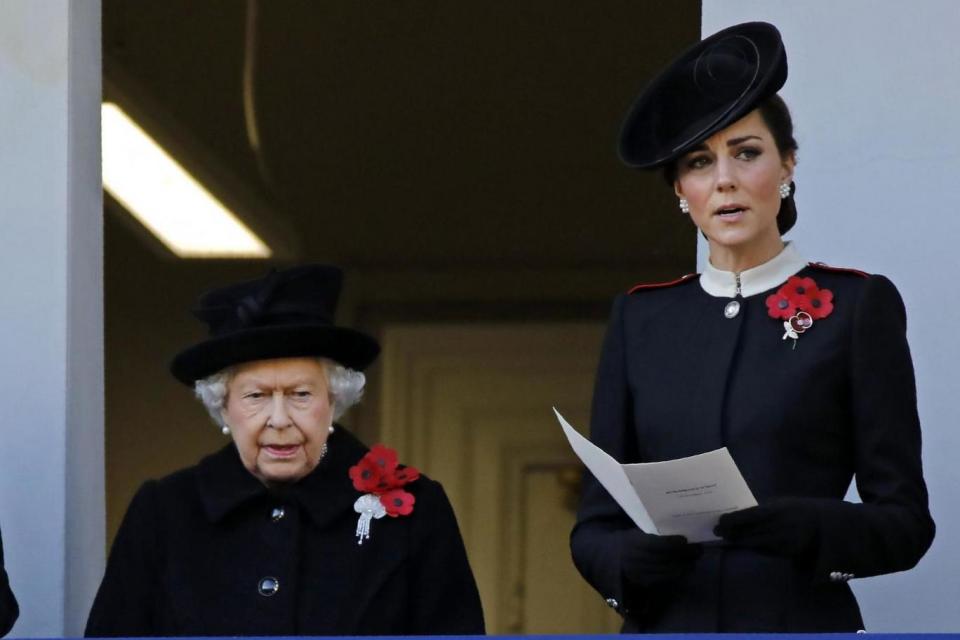 The Queen and Duchess of Cambridge watch at Charles lays a wreath at the Cenotaph for the Armistice Day centenary (AFP/Getty Images)