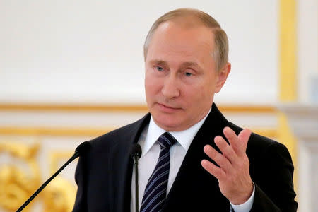 Russian President Vladimir Putin delivers a speech during the awarding ceremony for Russian Olympic medallists returning home from the 2016 Rio Olympics, at the Kremlin in Moscow, Russia August 25, 2016. REUTERS/Maxim Shemetov