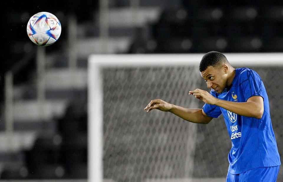 France's forward #10 Kylian Mbappe heads the ball during a training session at the Al Sadd SC training center in Doha, on December 8, 2022, in the build-up to the Qatar 2022 World Cup quarter final football match between France and England. (Photo by FRANCK FIFE / AFP) (Photo by FRANCK FIFE/AFP via Getty Images)