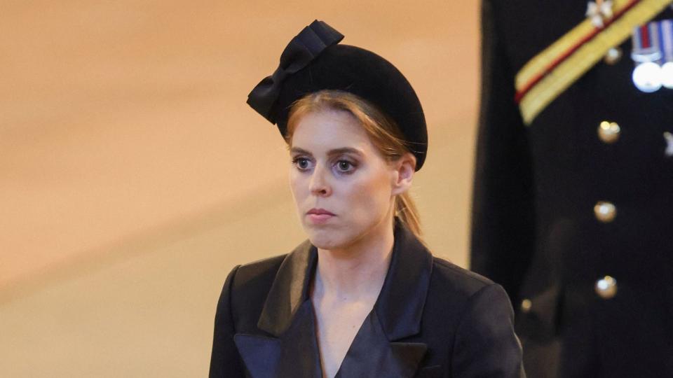 Britain's Princess Beatrice of York leaves ahaving held a vigil at the coffin of Queen Elizabeth II, in Westminster Hall, at the Palace of Westminster in London on September 17, 2022, ahead of her funeral