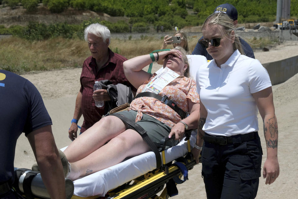 A passenger is transported after an Amtrak train derailed in Moorpark, Calif., on Wednesday, June 28, 2023. Authorities say an Amtrak passenger train carrying 190 passengers derailed after striking a vehicle on tracks in Southern California. Only minor injuries were reported. (Dean Musgrove/The Orange County Register via AP)