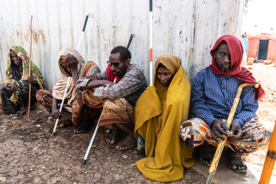 A group of blind Somalis sit in the shade of one of Baidoa's more cramped displacement sites. With over 450,000 displaced people living in and around Baidoa, the town now has the largest number of people in Somalia who have fled drought-stricken and militant-run areas to find safety. (Giles Clarke)