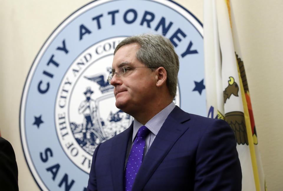 FILE - In this Aug. 14, 2017, file photo, San Francisco City Attorney Dennis Herrera listens to questions during a press conference at City Hall in San Francisco. The city of San Francisco took a dramatic step Wednesday, Feb. 3, 2021, in its effort to get children back into public school classrooms, suing its own school district to try to force open the doors amid the coronavirus pandemic. City Attorney Herrera, with the backing of Mayor London Breed, announced he had sued the San Francisco Board of Education and the San Francisco Unified School District in a statement and discussed it at a news conference. (AP Photo/Marcio Jose Sanchez, File)