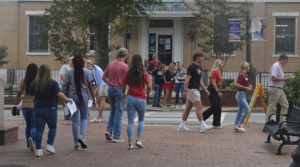 Split into groups, participants begin a photo scavenger hunt designed to acquaint them with downtown Louisville.