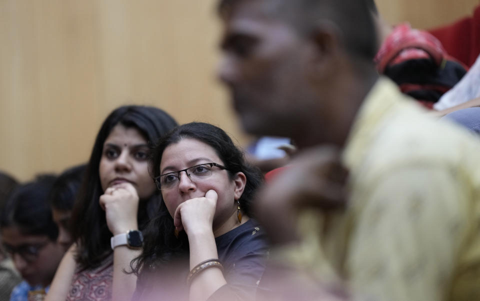 Delegates listen to a speaker during a 'People's Summit on G20" in New Delhi, India, Friday, Aug. 18, 2023. Indian police intervened to stop a meeting of prominent activists, academics and politicians discussing issues ahead of a summit of the Group of 20 industrialized and developing nations next month that will be hosted in New Delhi, citing law and order issues, the meeting's organizers said on Sunday. (AP Photo/Manish Swarup)