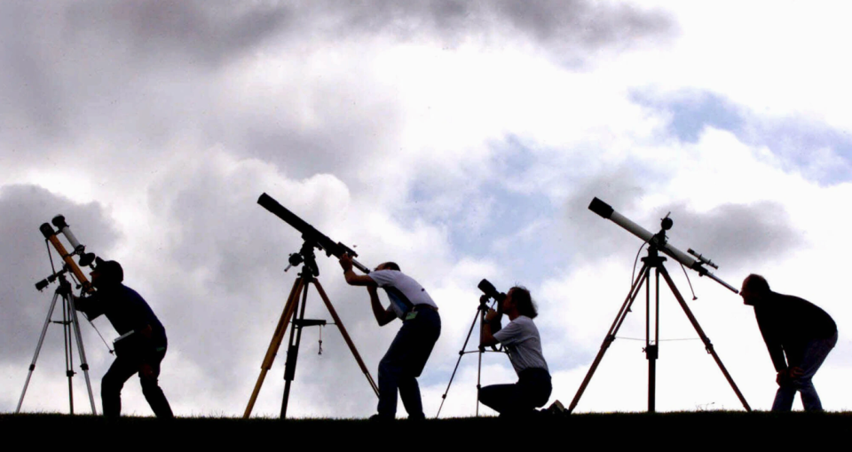 Members of the British Astronomers Association set up their telescopes on Aug. 10, 1999 to prepare for a total solar eclipse the next day.