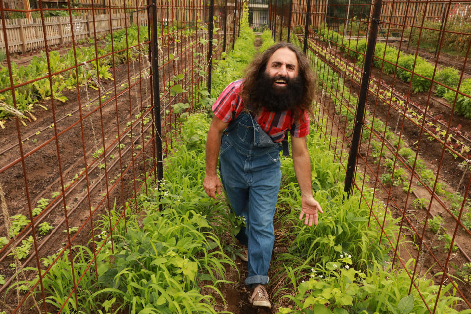 2019 Logie Award winner Costa Georgiadis pictured in a community garden on Gardening Australia