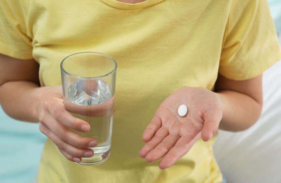 A self-managed abortion is the termination of pregnancy outside the formal health care system, often with self-sourced abortion pills. <a href="https://www.gettyimages.com/detail/photo/young-woman-with-abortion-pill-and-glass-of-water-royalty-free-image/1314748004?adppopup=true" rel="nofollow noopener" target="_blank" data-ylk="slk:Liudmila Chernetska/iStock via Getty Images Plus;elm:context_link;itc:0;sec:content-canvas" class="link ">Liudmila Chernetska/iStock via Getty Images Plus</a>