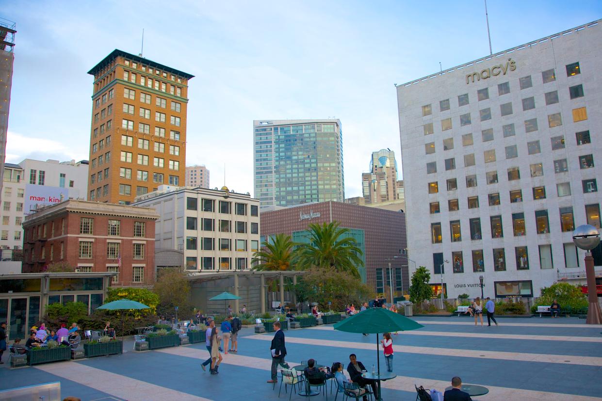 Buildings housing Macy's and other stores are seen around Union Square in San Francisco, California on a sunny day.