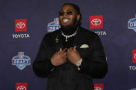 Alabama offensive tackle J.C. Latham poses on the red carpet ahead of the first round of the NFL football draft, Thursday, April 25, 2024, in Detroit. (AP Photo/Carlos Osorio)