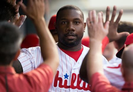 Jul 16, 2016; Philadelphia, PA, USA; Philadelphia Phillies first baseman Ryan Howard (6) is congratulated in the dugout after hitting a solo home run during the second inning against the New York Mets at Citizens Bank Park. Mandatory Credit: Bill Streicher-USA TODAY Sports