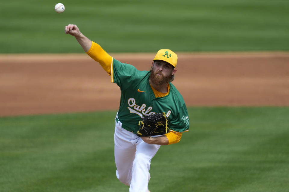 Oakland Athletics starting pitcher Paul Blackburn throws against the San Francisco Giants during the first inning of a spring training baseball game, Wednesday, Feb. 28, 2024, in Mesa, Ariz. (AP Photo/Matt York)