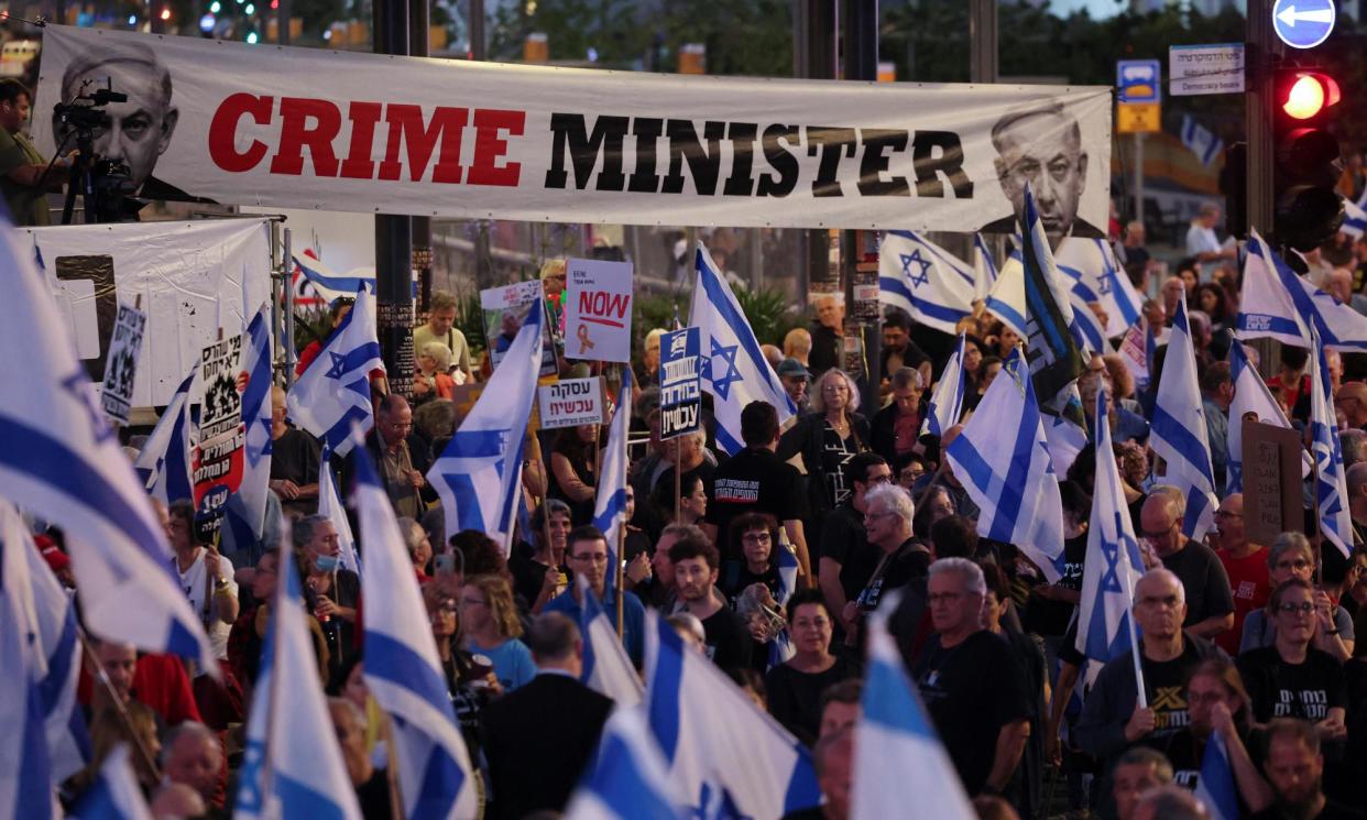 <span>People attend a protest against the Israeli prime minister Benjamin Netanyahu’s government in Tel Aviv.</span><span>Photograph: Ronen Zvulun/Reuters</span>