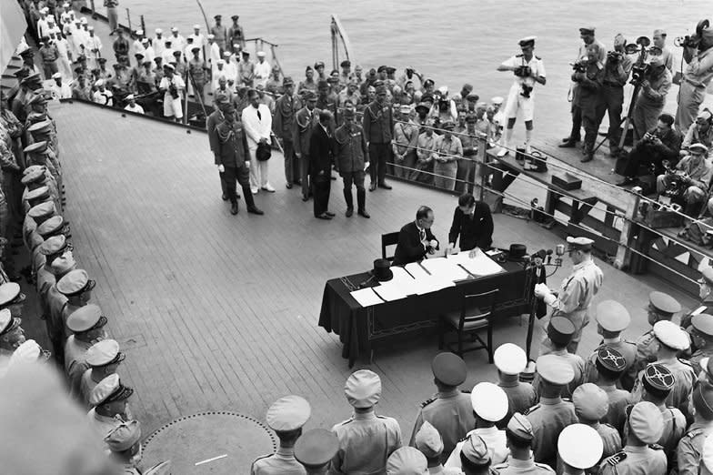 Foreign Minister Mamoru Shigemitsu and Gen. Yoshijiro Umezu of Japan sign the "complete capitulation of Japan" on September 2, 1945, aboard the USS Missouri in Tokyo. On August 30, 1945, Gen. Douglas MacArthur landed in Japan to oversee the country's formal surrender at the end of World War II. File Photo by Ed Hoffman/UPI