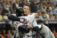 Detroit Tigers' Jeimer Candelario celebrates with teammate Miguel Cabrera after hitting a three-run home run against the Tampa Bay Rays during the first inning of a baseball game Saturday, Sept. 18, 2021, in St. Petersburg, Fla. (AP Photo/Scott Audette)