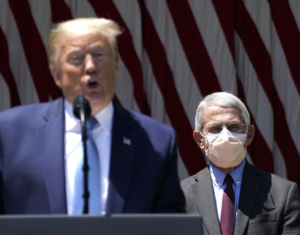 U.S. President Donald Trump is flanked by Dr. Anthony Fauci, director of the National Institute of Allergy and Infectious Diseases while speaking about coronavirus vaccine development in the Rose Garden of the White House on May 15, 2020 in Washington, DC. (Drew Angerer/Getty Images)