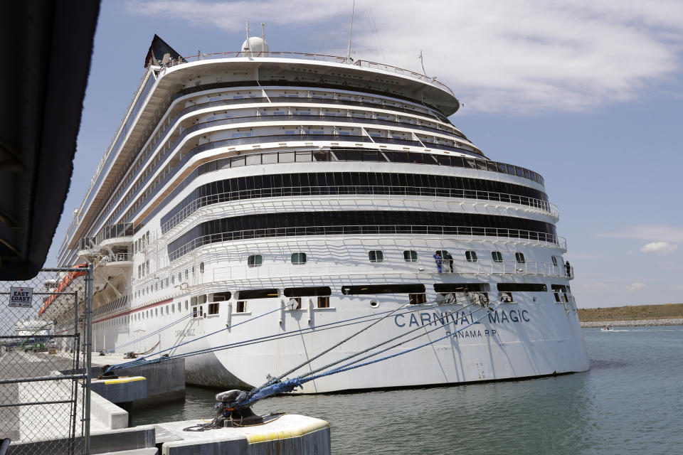 Carnival cruise line ship Carnival Magic is docked at Port Canaveral, Saturday, April 4, 2020, in Cape Canaveral, Fla. (AP Photo/John Raoux)