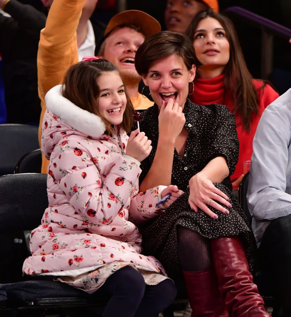 Katie's daughter Suri Cruise is 'excited' about becoming a big sister. Mother and daughter are pictured here at basketball game in NYC last year. Source: Getty