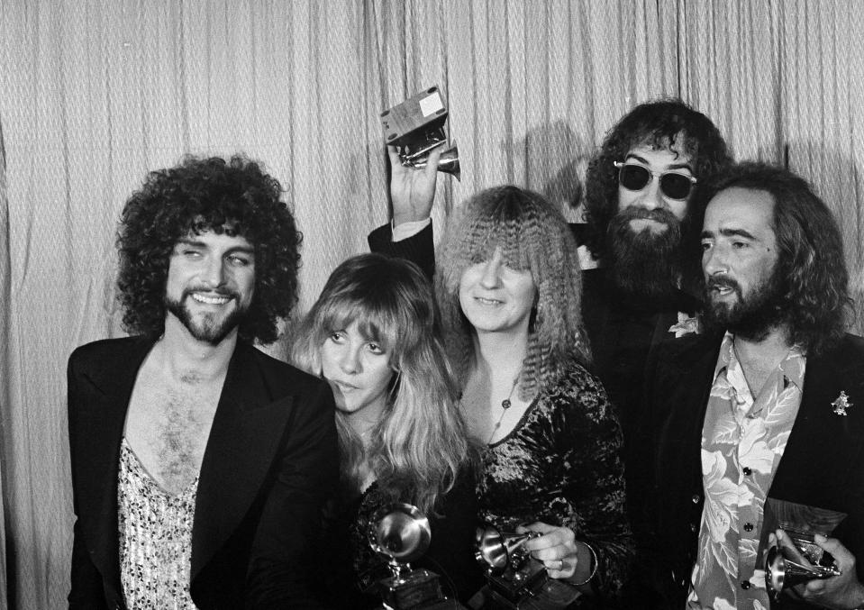 FILE - Members of the rock group Fleetwood Mac, from left, Lindsey Buckingham, Stevie Nicks, Christine McVie, Mick Fleetwood, and John McVie pose with their Album of the Year Grammy Award for "Rumours" in Los Angeles, Feb. 23, 1978. Christine McVie, the soulful British musician who sang lead on many of Fleetwood Mac’s biggest hits, has died at 79. The band announced her death on social media Wednesday. (AP Photo/Richard Drew, File)