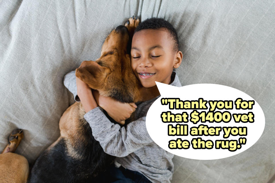 A little boy hugging his dog