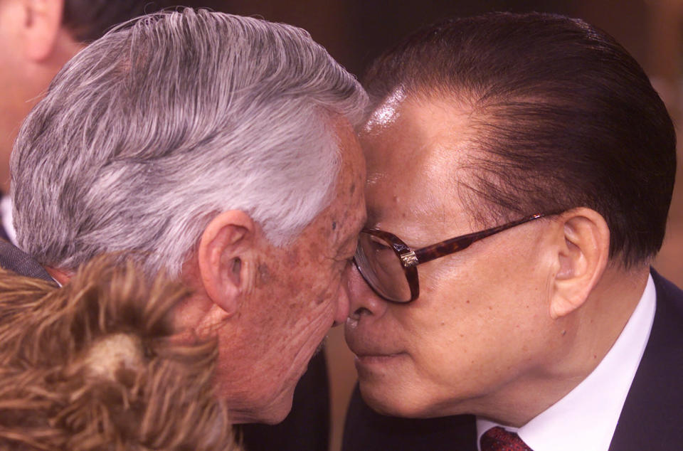 FILE - Chinese President Jiang Zemin, right, does the "Hongi", a traditional greeting of nose touching, with Maori Elder Hugh Kawharu at a welcoming ceremony for Asia Pacific Economic summit, APEC leaders in Auckland, New Zealand, Sept. 12, 1999. Chinese state TV said Wednesday, Nov. 30, 2022, that Jiang has died at age 96. (AP Photo/David Guttenfelder, File)