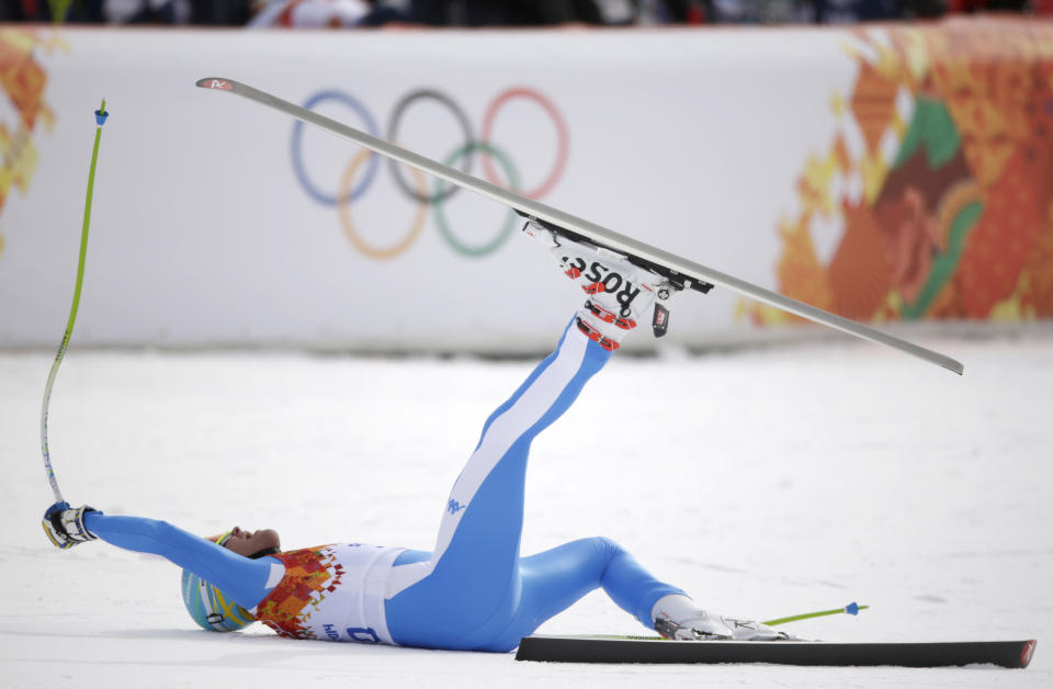 Italy's Christof Innerhofer celebrates after finishing the men's downhill at the Sochi 2014 Winter Olympics, Sunday, Feb. 9, 2014, in Krasnaya Polyana, Russia.